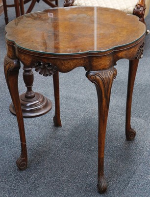 Lot 831 - A burr walnut petal shape lamp table, pierced...