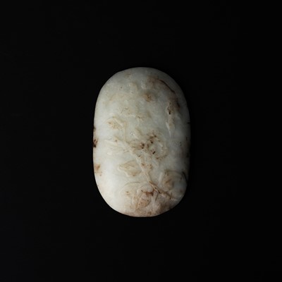 Lot 511 - A chicken chicken-bone jade 'floral' plaque, 19th century