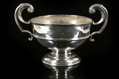 Lot 573 - A hallmarked silver twin handle footed cup...
