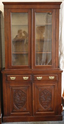 Lot 838 - A mahogany glazed book cabinet over drawers...