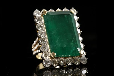 Lot 492 - An 18 yellow gold, emerald and diamond ring,...