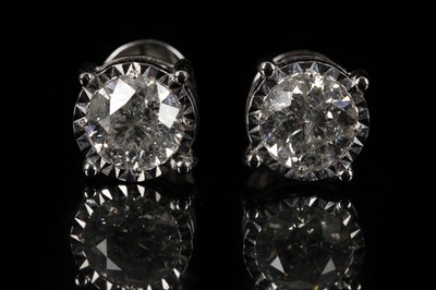 Lot 493 - A pair of 18ct white gold,  large screw-back...
