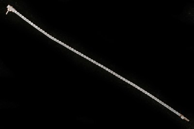 Lot 494 - An 18ct rose gold diamond tennis bracelet....