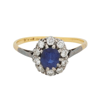 Lot 82 - A sapphire and diamond halo ring
