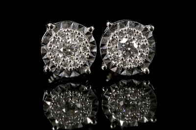 Lot 554 - A pair of 18ct white gold, screw-back diamond...