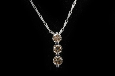 Lot 556 - A pair of 18ct white gold, 3 stone graduated...