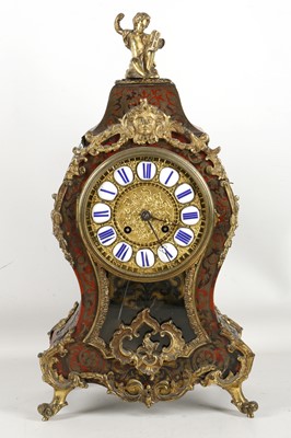 Lot 585 - A French, red tortoiseshell and brass inlaid...