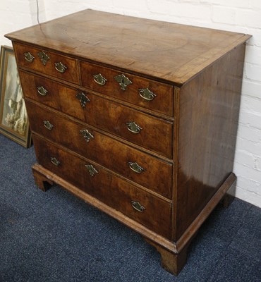 Lot 844 - An early Georgian, walnut chest of two short...