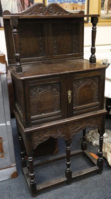 Lot 815 - Cabinet on stand, carved oak, 77 wide x 157cm...