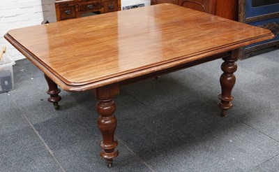 Lot 818 - A mahogany dining table on turned legs, 170 x...