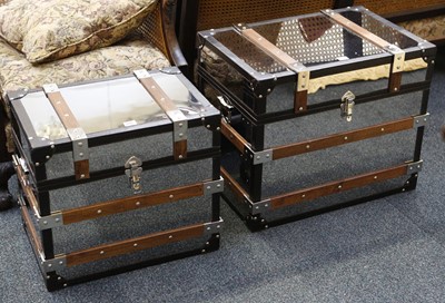 Lot 810 - Polished steel trunks, a graduated pair with...