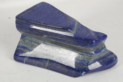 Lot 605 - A polished slab of lapis lazuli, 17cm.