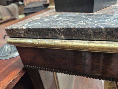 Lot 1 - A Regency revival rosewood, brass inlaid and parcel gilt mirrored console table