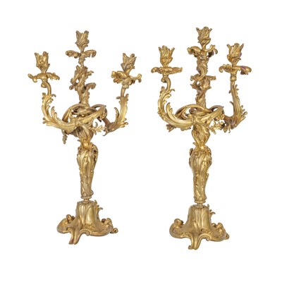 Lot 104 - A pair of Louis XV style giltwood three light candelabra