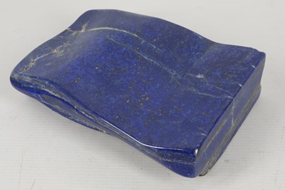 Lot 603 - A small polished slab of lapis lazuli, 19cm.