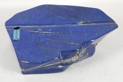 Lot 604 - A polished slab of lapis lazuli, 21cm.