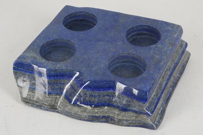 Lot 608 - A slab of polished lapis lazuli, drilled as a...