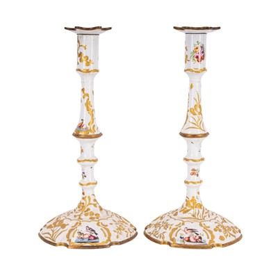 Lot 134 - A pair of Bilston enamel candlesticks