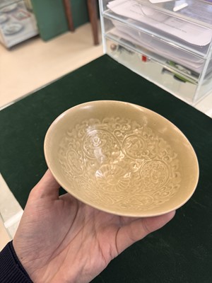 Lot 463 - A Chinese Yaozhou celadon 'lotus scroll' conical bowl, Song dynasty