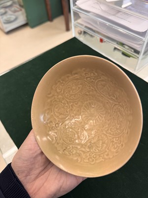 Lot 463 - A Chinese Yaozhou celadon 'lotus scroll' conical bowl, Song dynasty