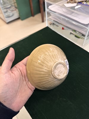 Lot 463 - A Chinese Yaozhou celadon 'lotus scroll' conical bowl, Song dynasty