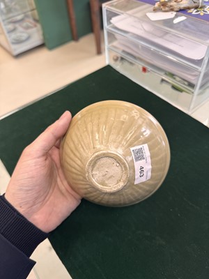 Lot 463 - A Chinese Yaozhou celadon 'lotus scroll' conical bowl, Song dynasty