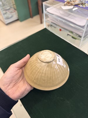 Lot 463 - A Chinese Yaozhou celadon 'lotus scroll' conical bowl, Song dynasty