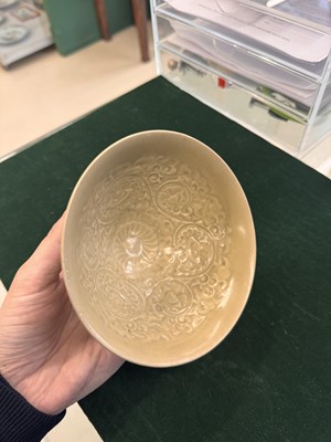 Lot 463 - A Chinese Yaozhou celadon 'lotus scroll' conical bowl, Song dynasty