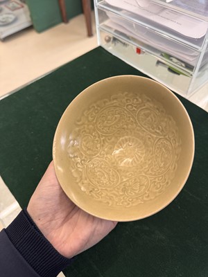 Lot 463 - A Chinese Yaozhou celadon 'lotus scroll' conical bowl, Song dynasty