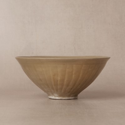 Lot 463 - A Chinese Yaozhou celadon 'lotus scroll' conical bowl, Song dynasty
