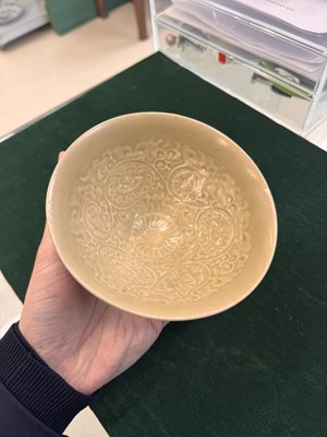 Lot 463 - A Chinese Yaozhou celadon 'lotus scroll' conical bowl, Song dynasty