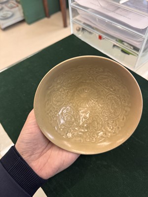 Lot 463 - A Chinese Yaozhou celadon 'lotus scroll' conical bowl, Song dynasty
