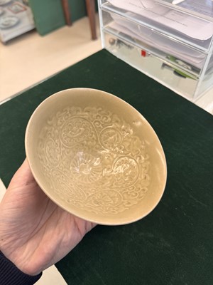 Lot 463 - A Chinese Yaozhou celadon 'lotus scroll' conical bowl, Song dynasty