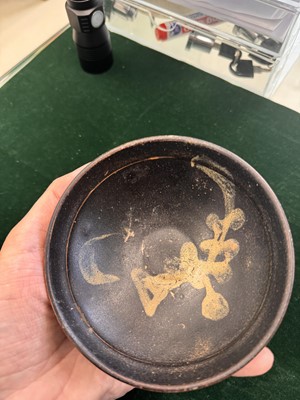 Lot 457 - A Chinese Jizhou glazed-glaze 'floral' painted bowl, Southern Song dynasty