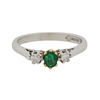 Lot 170 - An emerald and diamond three stone ring