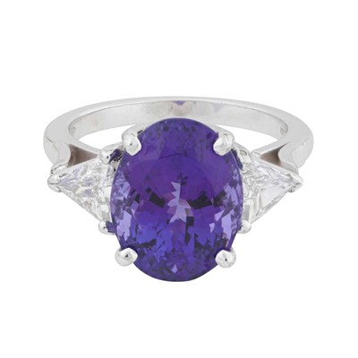 Lot 81 - A tanzanite and diamond three stone ring, circa 2006