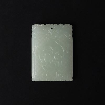 Lot 538 - A Chinese jade 'double peach' plaque, 19th/20th century