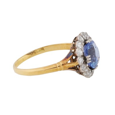 Lot 25 - A sapphire and diamond halo ring