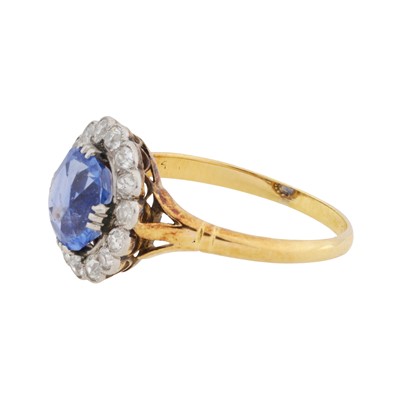 Lot 25 - A sapphire and diamond halo ring