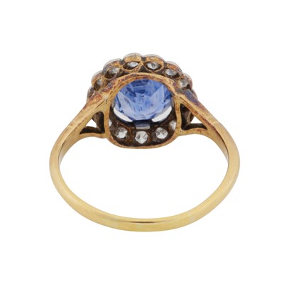 Lot 25 - A sapphire and diamond halo ring