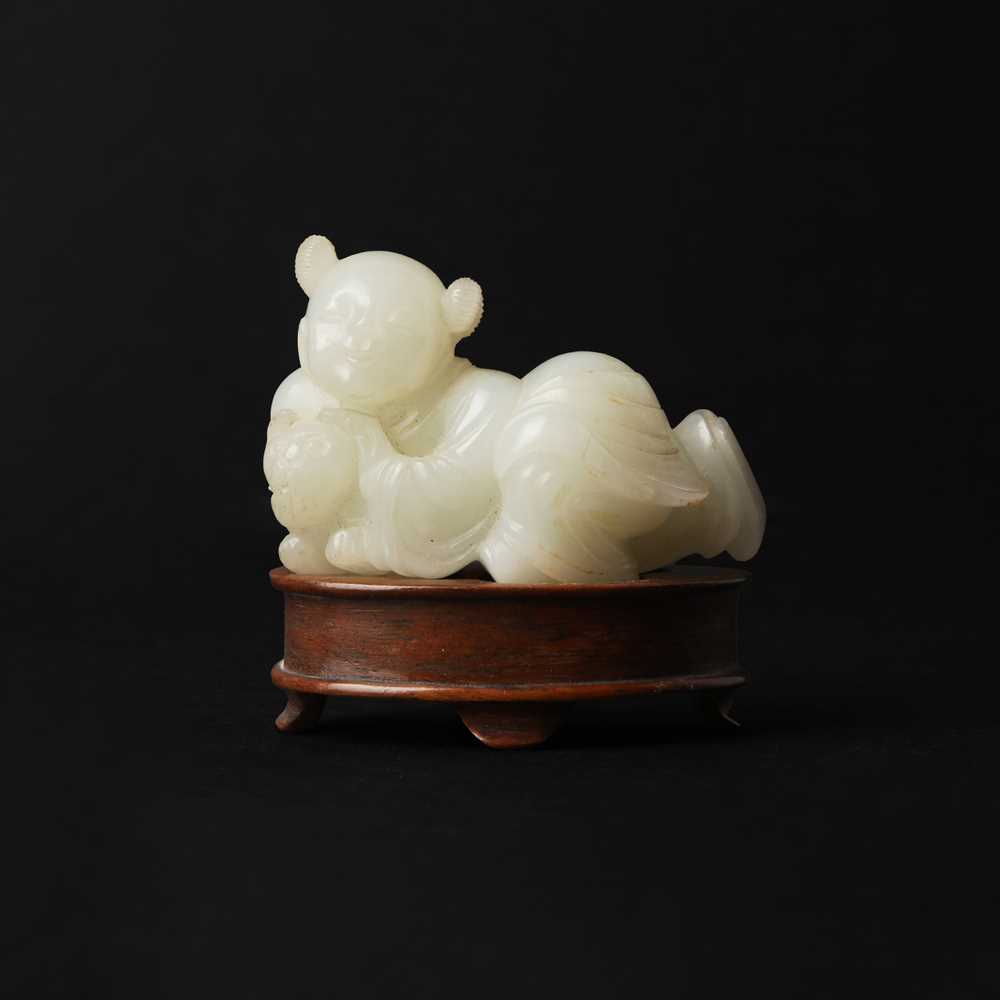 106 - A Chinese jade 'boy and cat' carving, Qing dynasty, 19th century