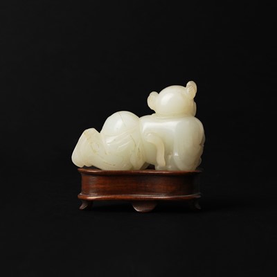 Lot 106 - A Chinese jade 'boy and cat' carving, Qing dynasty, 19th century