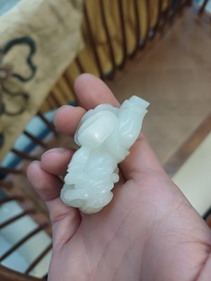 Lot 106 - A Chinese jade 'boy and cat' carving, Qing dynasty, 19th century