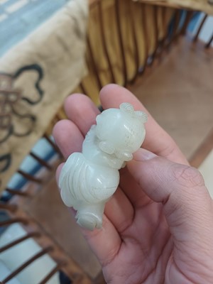Lot 106 - A Chinese jade 'boy and cat' carving, Qing dynasty, 19th century