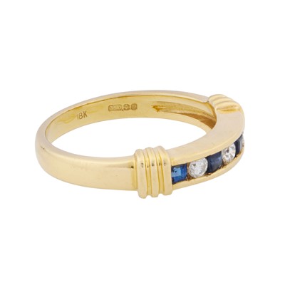 Lot 34 - A sapphire and diamond band ring, circa 1992
