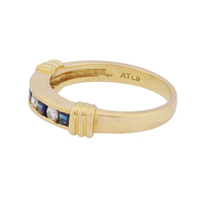 Lot 34 - A sapphire and diamond band ring, circa 1992