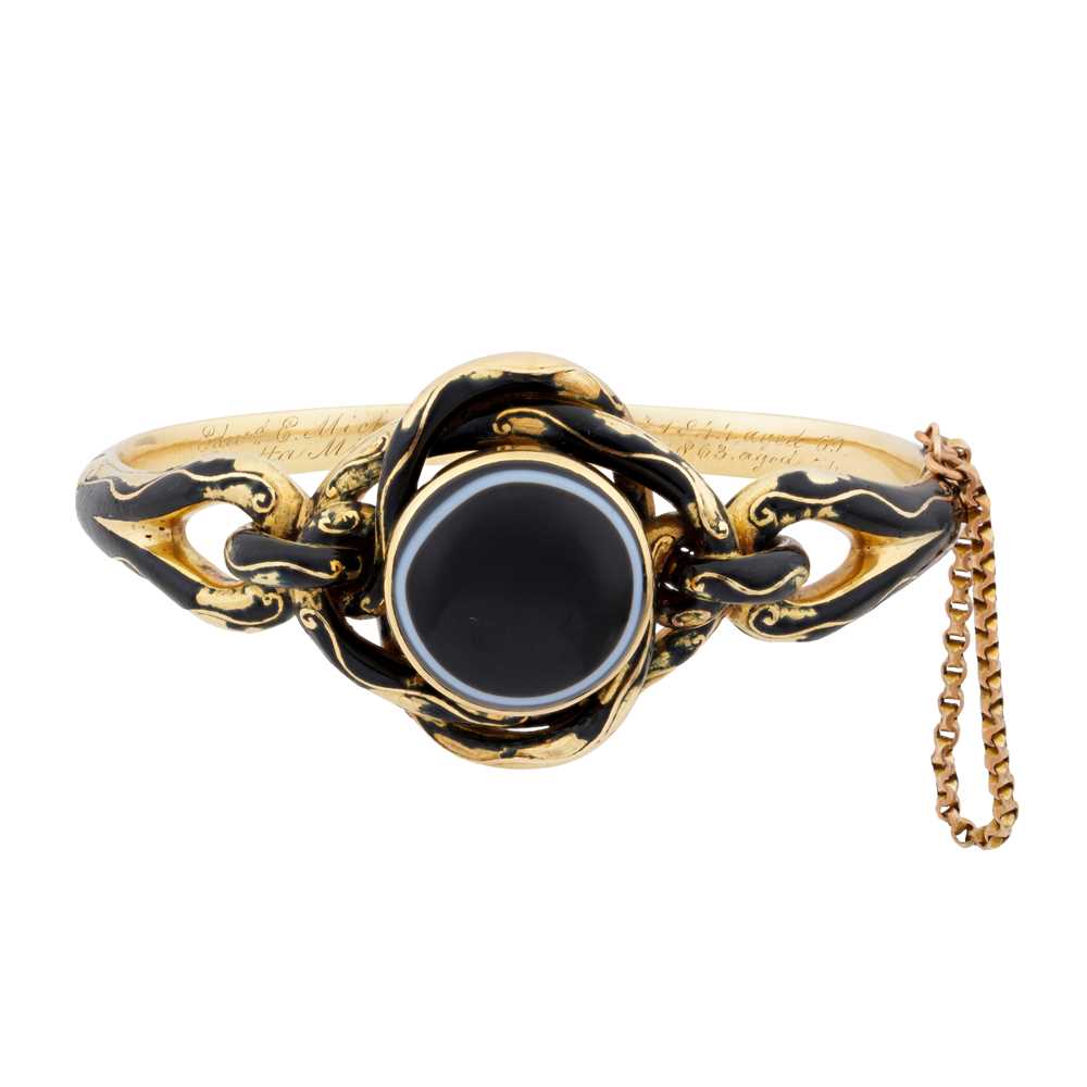 Lot 13 - An enamel and banded agate mourning bangle