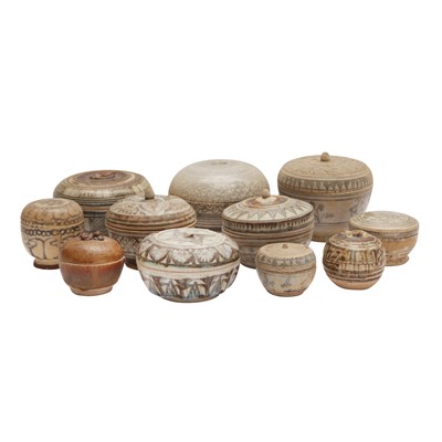 Lot 693 - A large group of Thai Sawankhalok box and covers, 14th/16th century