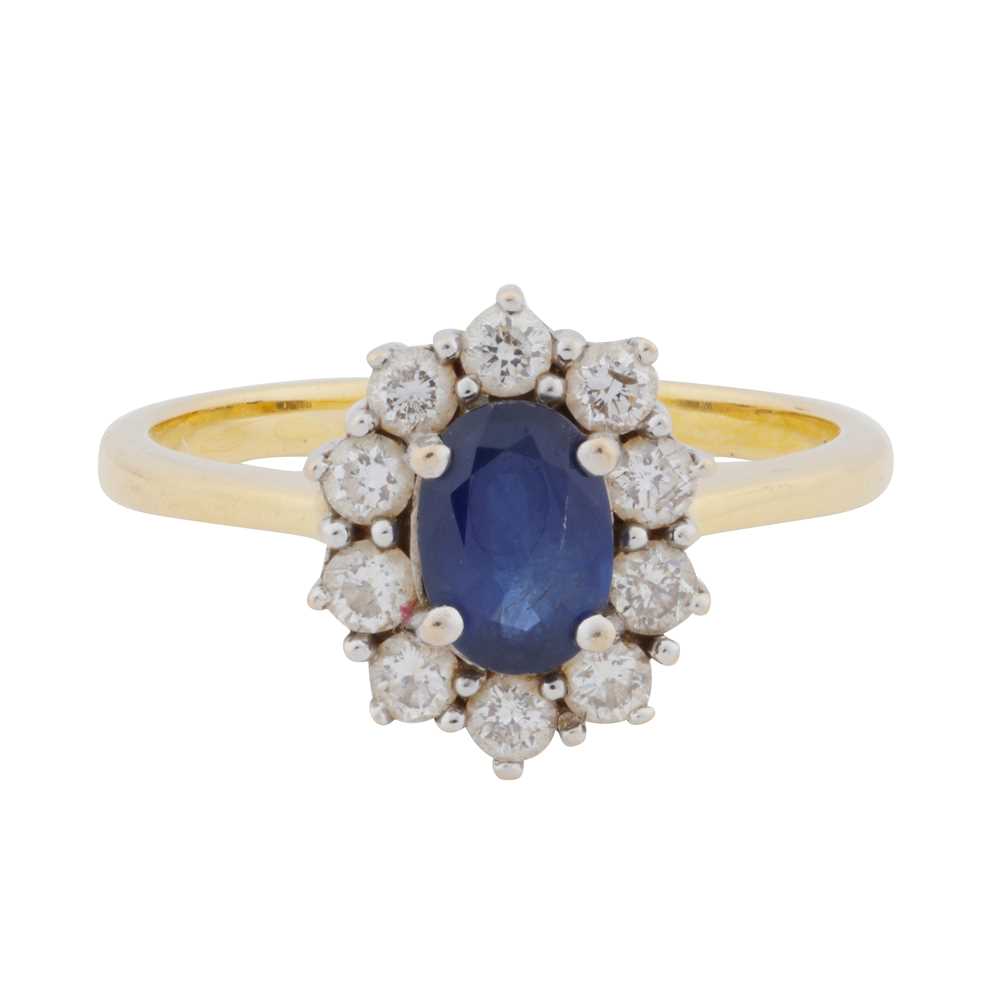 Lot 38 - A sapphire and diamond halo ring