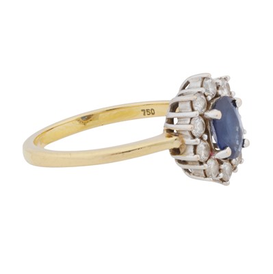 Lot 38 - A sapphire and diamond halo ring